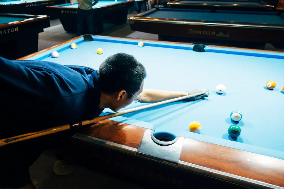 Image description: A person holding a pool cue, ready to strike the cue ball.